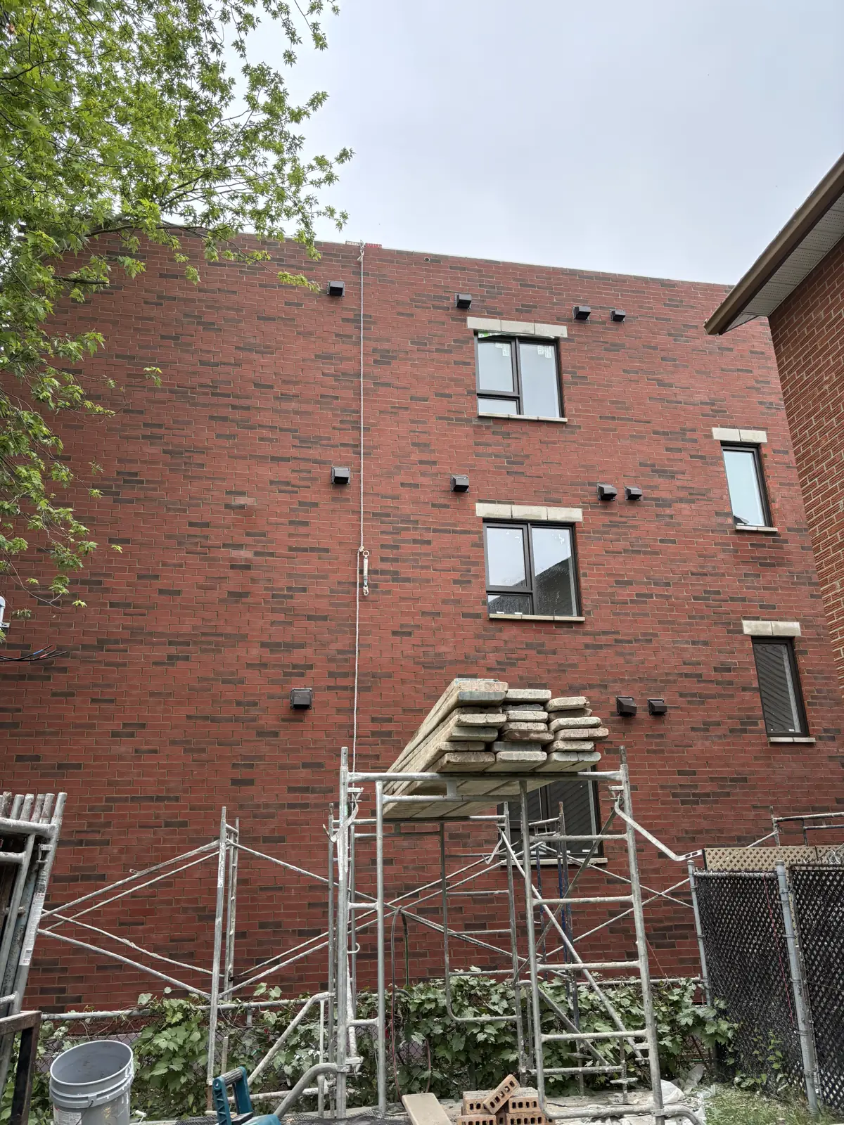 Brick apartment building with scaffolding