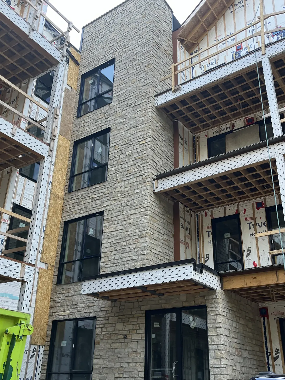 Four-storey building clad in stone